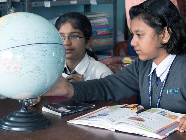 Student with Globe
